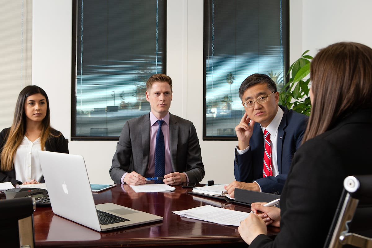 IPLG attorneys in a client consultation at the firm's office.